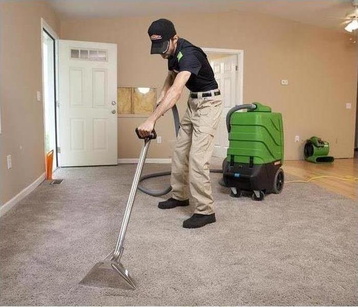 Technician cleaning carpets