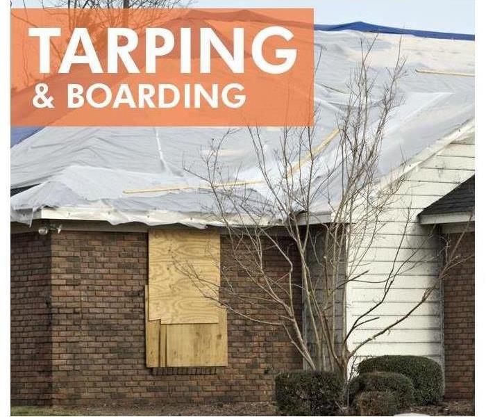 Tarping and boarding of a building